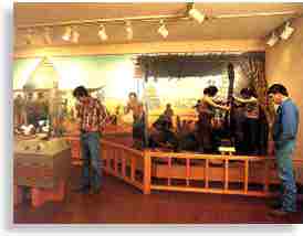 diorama at Caddoan Museum></A>

<FONT SIZE=1>Authentic diorama at Caddoan Mounds State<BR>Historic  Site near Alto.</FONT><BR>

	<B>General--</B><BR>

  Originally a stop on the

        Old San Antonio Road, town is tomato-growing center in redland

        belt. Name derives from Spanish word for "high" (highest

        point between Angelina and Neches Rivers).

        The grave of Helena Kimble Dill, believed by many to be the mother

        of the first Anglo child born in Texas (1804) is here (Jane Long

        , of Galveston, often is credited as mother of Texas' first Anglo child

        in 1821). Contact local chamber of commerce for information about other sites of interest in this historically

        rich area, or Park Superintendent, Caddoan Mounds State Historic Site.<BR>

        

<P>



<b>Caddoan Mounds State Historic Site</b> -<BR>

 A chief archaeological site in Texas. Park includes full-size replica

of Caddoan house built with Stone-Age-type tools, visitor center

with exhibits, interpretive trail. Two ceremonial mounds of 300

by 350 feet are remains of ancient Indian culture. Open Fri. - Mon.

10 a.m. - 6 p.m.; Thurs. by appointment. Closed Thanksgiving,

Christmas Eve, and Christmas. Six miles southwest on Texas 21.

Admission.

</p>

<A HREF=